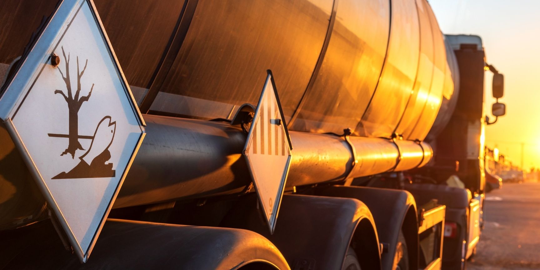 Contamination hazard labels on a tanker truck for the transport of dangerous goods